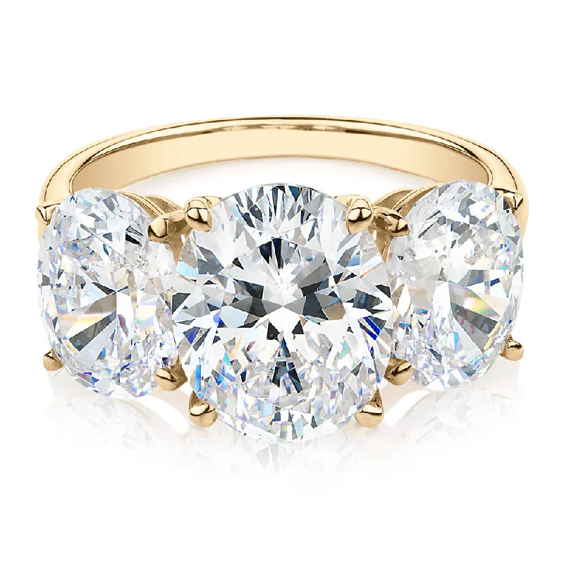 diamond rings for women -Three stone ring with 7.57 carats* of diamond simulants in 10 carat yellow gold