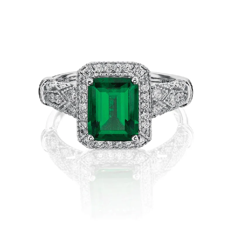 engagement rings for women -Dress ring with 9x7mm emerald simulant and 0.27 carats* of diamond simulants in 10 carat white gold