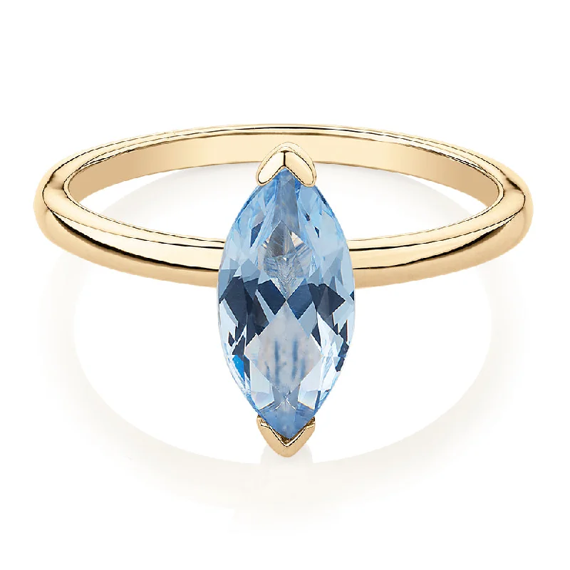 stackable diamond rings -Dress ring with aquamarine simulant in 10 carat yellow gold