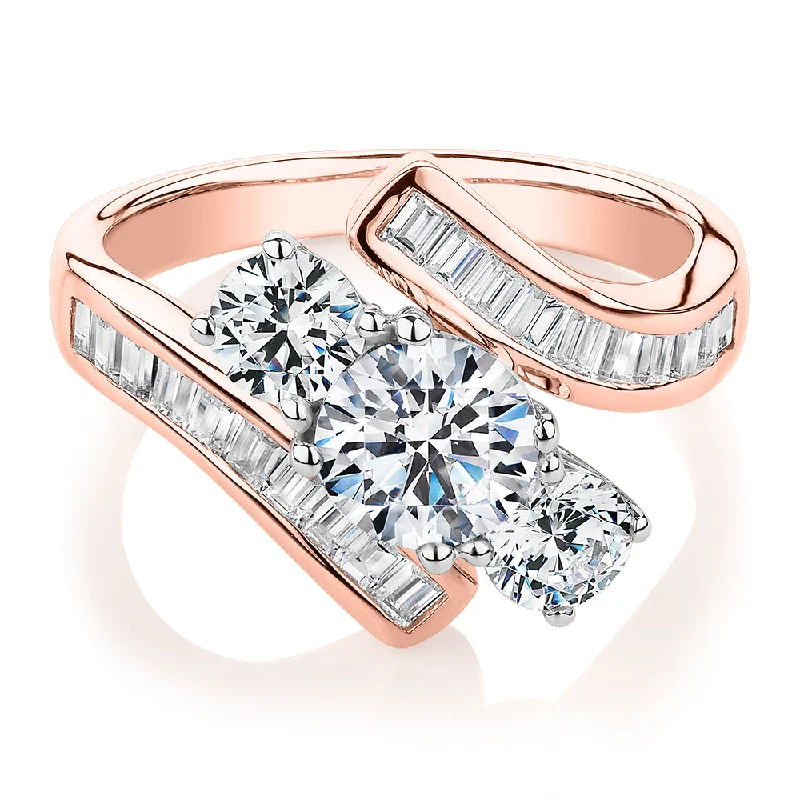 wedding rings for women -Three stone ring with 2.63 carats* of diamond simulants in 10 carat rose and white gold