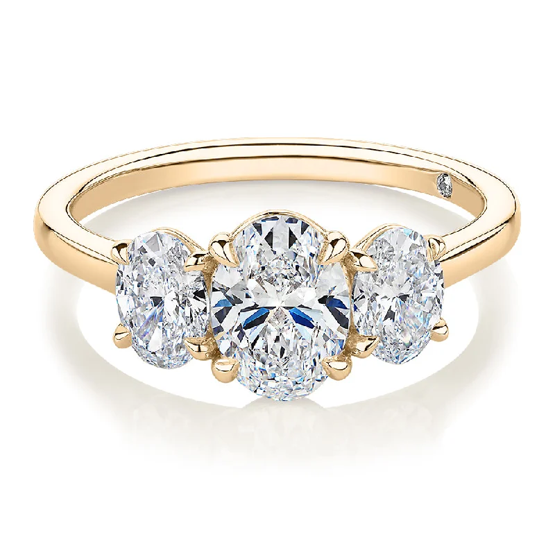 women’s birthstone rings -Signature Simulant Diamond 1.87 carat* TW oval three stone ring in 14 carat yellow gold