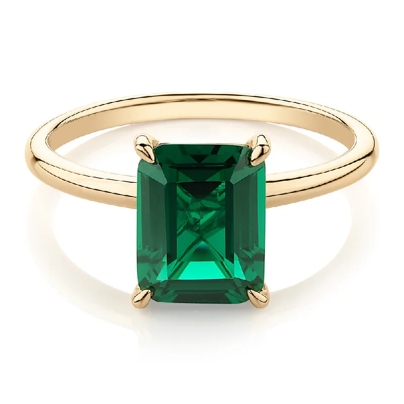 unique rings for women -Dress ring with emerald simulant in 10 carat yellow gold